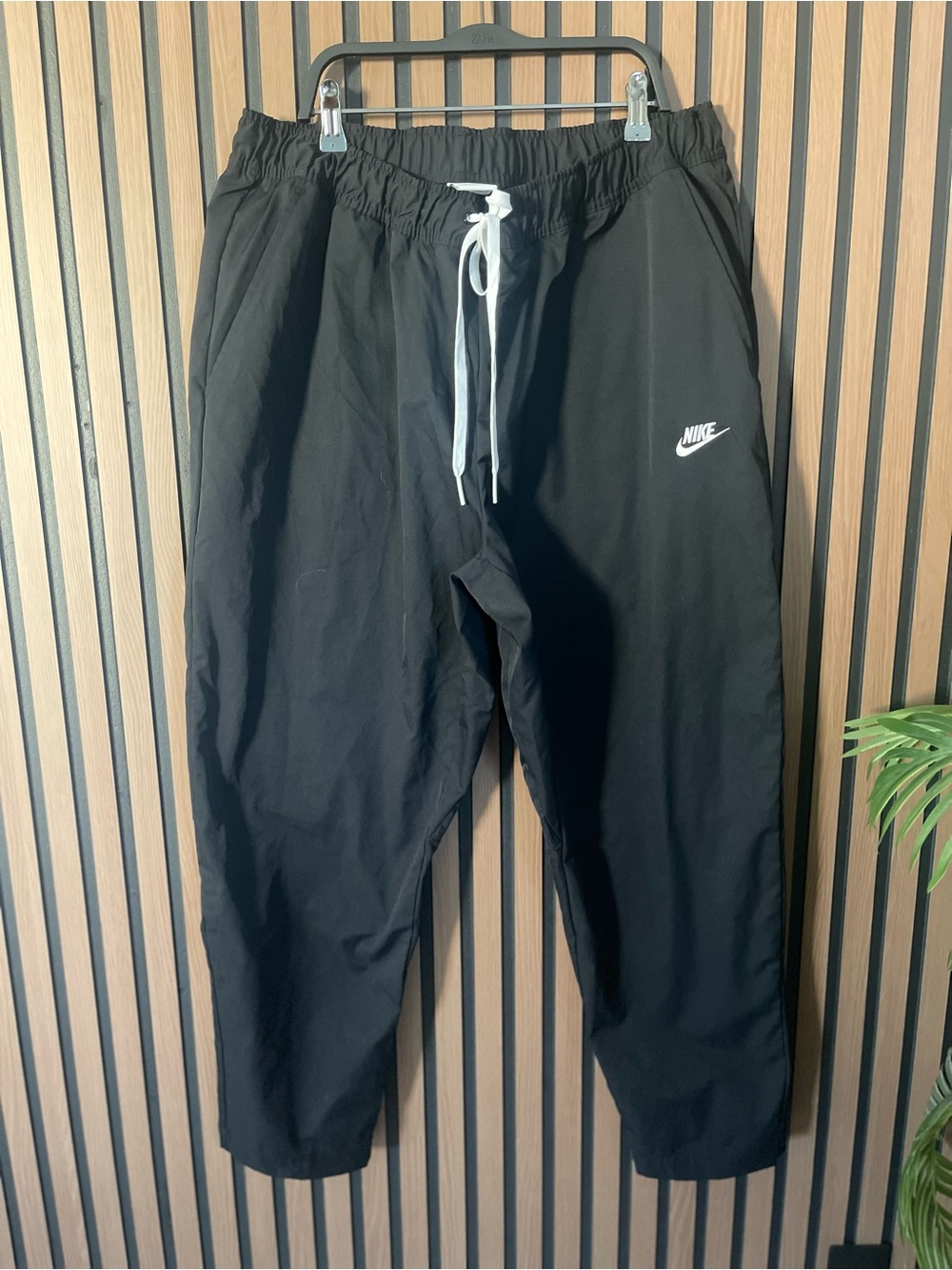 Nike black track pants with drawstring waist and tapered fit size XXL